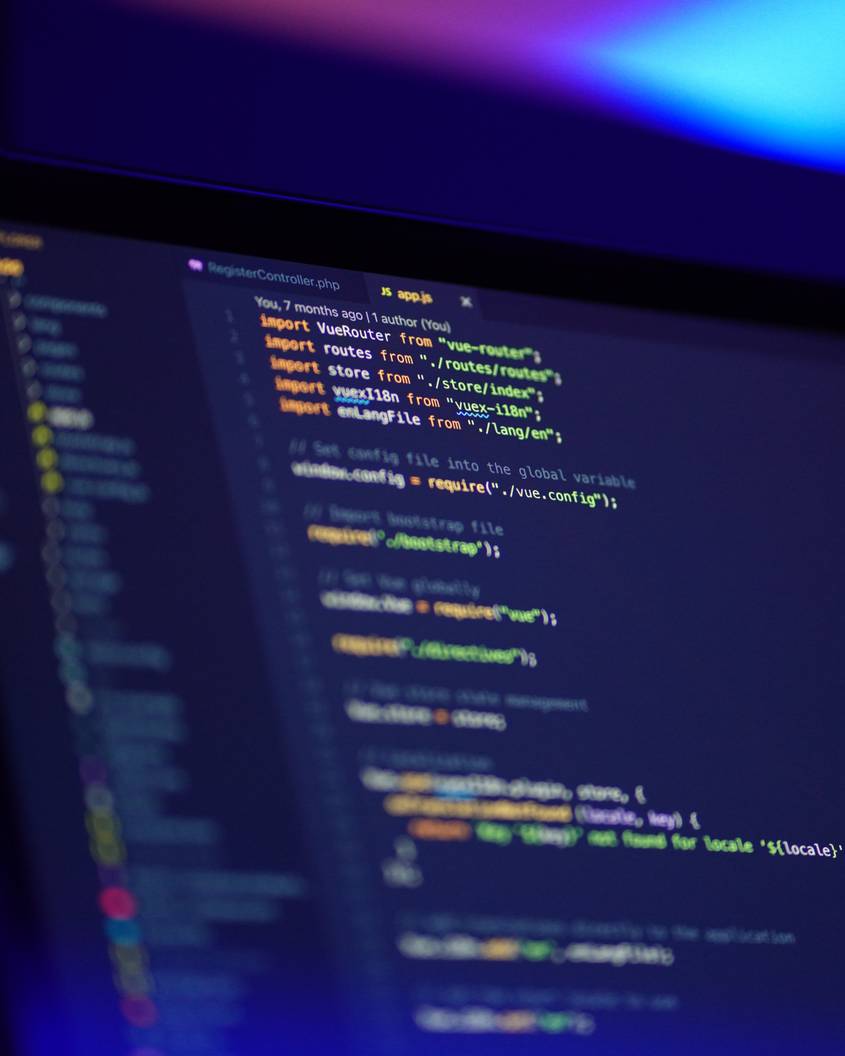 Photo of a computer screen with Vue.js code on it